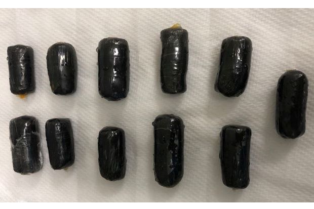 heroin-filled pellets expelled by a 35-year-old internal courier