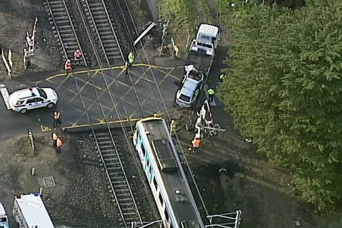 Two vehicles hit by Melbourne train after drivers exchange details on the track1