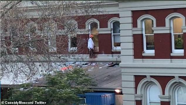 Naked man on train station roof puts Perth street in lockdown